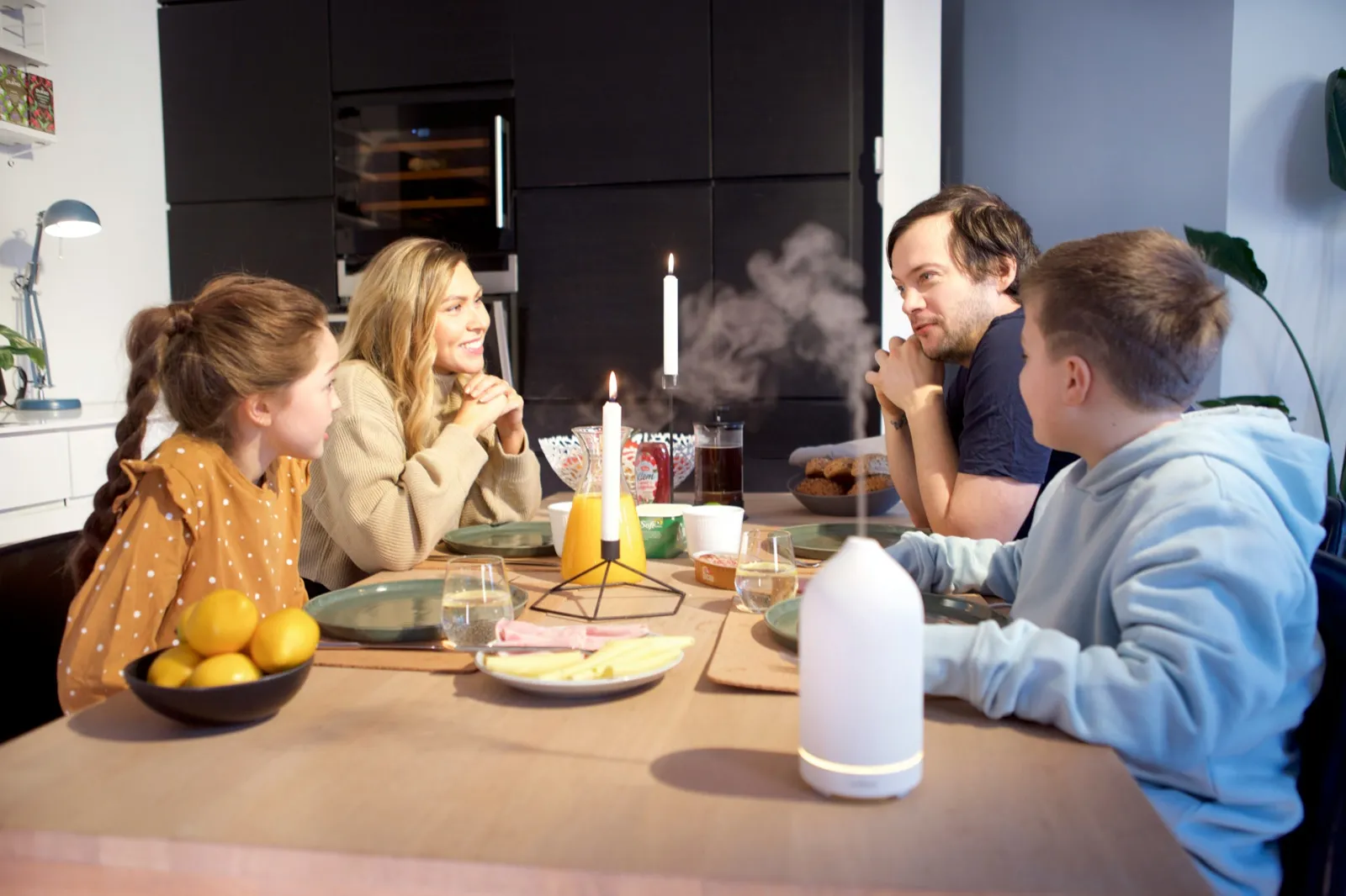 A family talking together around a dinner table