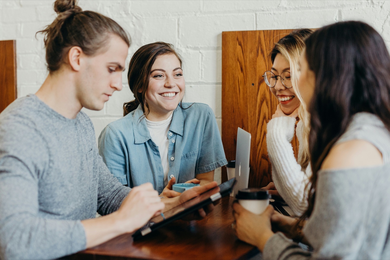 A group of friends listening to one another during a conversation